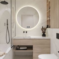 a bathroom with a round mirror above the sink and a white toilet next to it