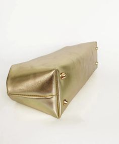 Embrace Timeless Elegance with the Gilded Muse Clutch! Elevate your everyday style with the Gilded Muse Clutch, a women's clutch handbag that exudes sophistication and understated glamour. This unique piece features a luxurious, shiny textured artificial leather in a captivating golden hue, perfect for adding a touch of Midas' touch to any outfit. A Touch of Golden Luxury: Luxurious Texture: Experience the difference in the captivating shiny textured finish of the artificial leather. This unique Understated Glamour, Midas Touch, Straw Bags, Ladies Clutch, Artificial Leather, Accessories Necklace, Everyday Style, Clutch Handbag, Ring Bracelet