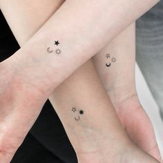 two people with matching tattoos on their arms