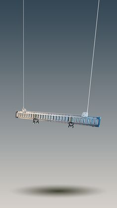 an electric device suspended by wires on a gray background