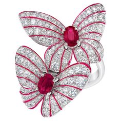 Magnificent 18 karat white gold ring designed with 2 pavé diamond butterflies. Each butterfly centers an oval ruby. The delicacy and vibrancy of the butterfly is further enhanced with hand painted iridescent red enamel. Total Diamond weight =1.70 carats Total Ruby weight =2= 0.95 carats Ring size 7 Length = 1-1/8'" Rubies And Diamonds, Ruby Rings, Gold Ring Designs, Red Jewelry, Diamonds Ring, Butterfly Ring, Sapphire Pendant, Butterfly Jewelry, Ruby Jewelry