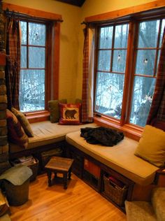 a living room filled with furniture and windows