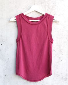 Effortless lightweight cotton tank featuring cap sleeves, exposed stitching, and a rounded hem. Crewneck  100% Cotton; Machine Wash Cold   XS S M BUST 28" 29" 30" WAIST 28" 29" 30" LENGTH 21.5" 21.5" 22.5" Makeup Stain, Basic Tank Top, Cap Sleeves, Raspberry, Sleeveless Top, Free People, Stitching, Crew Neck, Tank Tops