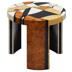 an artistically designed wooden table with black and white stripes on it's sides