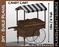 an old fashioned candy cart with awnings on the top is shown in front of a wooden background