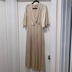 New With Tags. Never Worn. Super Long And Clips At Front. I Would Say It Runs More As A Small. Material Is Rayon Fabric. Comment If You Have Any Questions! Measurements: Bust= 36 In. Waist= 35 In. Hip= 42 In. Flare= 90 In. Top To Hem= 125 In. Waist To Hem= 87 In. Cream Silk V-neck Maxi Dress, Cream V-neck Maxi Dress For Date Night, Cream Silk Midi Dress With V-neck, Silk V-neck Maxi Dress For Daywear, H&m V-neck Maxi Dress For Daywear, Vintage V-neck Dress For Date Night, H&m V-neck Daywear Dress, H&m V-neck Maxi Dress For Brunch, Elegant Cream Dress By H&m