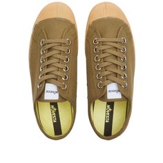 Novesta takes inspiration from both the sporting and the military worlds to create this version of its signature Star Master. It’s made in the label’s home country, Slovakia, with olive green uppers and a gum rubber sole that retains all the vulcanisation marks..Canvas Uppers.Rubber Toe Cap.Vulcanised Rubber Sole.Made in Slovakia Khaki Sneakers With Vulcanized Sole, Khaki Sneakers With Vulcanized Sole And Round Toe, Canvas Slip-on Sneakers With Gum Sole For Streetwear, Low-top Slip-on Sneakers With Vulcanized Sole For Skateboarding, Khaki Low-top Sneakers For Outdoor, Khaki Lace-up Sneakers With Rubber Sole, Khaki Low-top Sneakers With Vulcanized Sole, Khaki Lace-up High-top Sneakers With Rubber Sole, Lace-up Canvas Shoes With Rubber Sole For Skateboarding