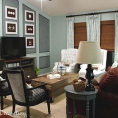 a living room filled with furniture and a flat screen tv