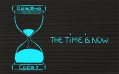 an hourglass with the words the time is now written in blue chalk on a black background