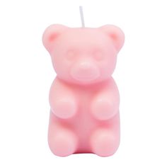 a pink bear shaped candle with a white stick sticking out of it's side