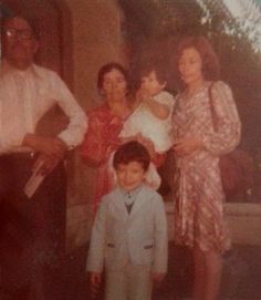 an old photo of a family posing for a picture