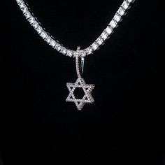 Introducing the Micro Diamond Pave Star of David Pendant- a symbol of protection, unity, and connection. Crafted with detail and care, this pendant shines with hand-set baguette stones, honoring the Jewish religion. Whether worn as a statement piece or as a daily reminder of faith and tradition, this pendant seamlessly blends style with spirituality. Pair it with a Diamond Tennis Chain for a set that will shine! This product is guaranteed for life - GLD will repair the item should you experience Silver Star Of David Charm Jewelry, Diamond White Star-shaped Cubic Zirconia Jewelry, Diamond White Cubic Zirconia Star Jewelry, Silver Cubic Zirconia Star Of David Jewelry, Luxury Silver Star Of David Jewelry, Silver Diamond Jewelry With Star Charm, White Gold Cubic Zirconia Star Of David Jewelry, Luxury Sterling Silver Star Of David Jewelry, Luxury White Gold Star Of David Jewelry