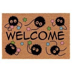 a welcome mat with black and white cartoon characters on it, including the words welcome