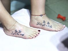 two people with matching tattoos on their feet