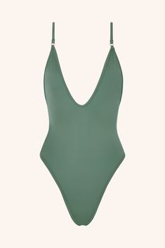 Shine bright in our iconic gold one-piece swimsuit. Designed with a bold plunging neckline and a radiant golden hue, this piece exudes confidence and glamour with every move. Whether you're lounging poolside or catching waves, this gold one-piece bathing suit is the ultimate style statement. Cut & Fit Shaping, sculpting fit Pulls on Plunging neckline High-cut style with medium coverage brief Hardware & Straps All gold hardware Adjustable shoulders straps Lining & Fabric Double-lined Gold One Piece, Brown One Piece, Grey One Piece, Purple One Piece, Green One Piece Swimsuit, Green One Piece, Red One Piece, Blue One Piece Swimsuit, Blue One Piece