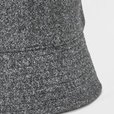 Give your summer looks a casual-cool kick with this Recycled Polyester Bucket Hat from Goodfellow & Co™. Designed with a 2.75-inch brim, this gray bucket hat features stylish reinforced stitching details and embroidered eyelet holes for a breezy look that goes well with any outfit. Made of midweight knit material, it provides a comfortable fit for all-day wear, and the pull-on style makes it easy to put on or take off. Goodfellow & Co™: Feel good in what you wear, anywhere. Casual Black Bucket Hat For Winter, Casual Black Winter Bucket Hat, Black Lightweight Casual Bucket Hat, Casual Winter Bucket Hat With Short Brim, Casual Brimmed Hat, Casual Lightweight Black Bucket Hat, Casual Black Bucket Hat For Everyday, Casual Bucket Hat With Short Brim For Fall, Casual Bucket Hat For Fall