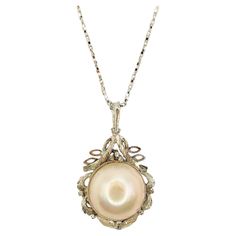 Introducing our Vintage Baroque Style 14mm Mabé Pearl Necklace Pendant in Sterling Silver, a stunning piece that showcases the timeless elegance of a lustrous Mabé Pearl in a unique and intricate design. At the center of this pendant rests a stunning creamy white Mabé Pearl, boasting a smooth and lustrous surface. With its shimmering iridescence and creamy white appearance, this pearl exudes timeless charm and sophistication. Each pearl is carefully selected for its exceptional quality, ensuring Mabe Pearl Necklace, Baroque Necklace, Pearl Necklace Pendant, Diamond Pendants Designs, Style Baroque, Mabe Pearl, Ornate Design, Baroque Style, Baroque Fashion