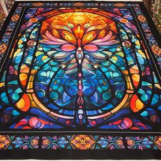 a large stained glass window in the shape of a tree