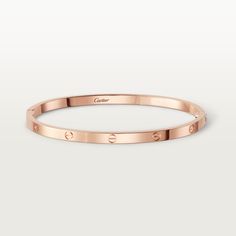 Cartier - LOVE bracelet, small model - Bracelet Woman Pink gold - LOVE bracelet, small model, 18K rose gold (750/1000). Sold with a screwdriver. Width: 3.65 mm (for size 17). The iconic LOVE bracelet has been a symbol of free-spirited LOVE since 1969. Its screw motif and famous locking technology are truly timeless design signatures, while its oval shape ensures a close but comfortable fit to the wearer’s wrist. The locking mechanism consists of a single functional screw on one side of the bracelet and a hinge on the other. Each LOVE bracelet is sold with a matching screwdriver specifically created for this piece. To discover your recommended LOVE bracelet size, please visit our Bracelet Sizing Chart. Add one centimeter to your size for a tight fit, or two centimeters for a looser fit. Ple Bf Gifts, Aesthetic Roses, Cartier Bracelet, Love Bracelet, Locking Mechanism, Free Spirited, Bracelet Collection, Cartier Love Bracelet, Love Bracelets