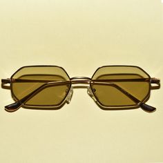 A pair of new vintage style retro mod beatnik translucent hexagon sunglasses that feature a gold rim design. Retro Gold Sunglasses For Summer, Gold Retro Sunglasses For Summer, Gold Retro Summer Sunglasses, Vintage Gold Sunglasses For Summer, Translucent Sunglasses, Hexagon Sunglasses, Rim Design, San Gabriel, Mode Vintage