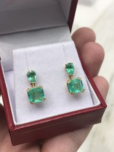 Colombian emerald dangling studs in fine 14K yellow gold. Displayed are medium-green teardrop and Asscher cut emeralds with very good transparency, accented by a simple prong gold mount, allowing for the emeralds to be shown in full view. The earth mined, green emeralds have a desirable lush green color with excellent qualities. These earrings are ideal for everyday use and are the perfect accessory to any outfit. Total Carat Weight: 3.40tcw Setting Style: Four Prong/ Double Prong Setting Materi Emerald Pear-shaped Fine Jewelry Earrings, Fine Jewelry Emerald Pear-shaped Earrings, Pear-shaped Emerald Earrings For Anniversary, Pear-shaped Emerald Earrings Fine Jewelry, Classic Emerald Pear-shaped Earrings, Green Teardrop Earrings With Prong Setting, Classic Pear-shaped Emerald Earrings, Formal Pear-shaped Emerald Earrings, Fine Jewelry Emerald Teardrop Earrings