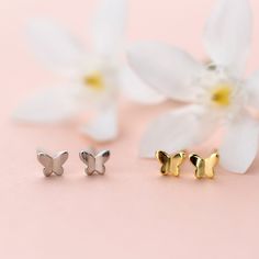 Experience the luxury of these solid 925 sterling silver stud earrings, delicately coated in 18k gold for a glamorous touch. The dainty, minimalistic butterfly design adds a touch of elegance to any outfit, and its small size allows for versatile wear on the earlobes, second earlobe holes, or tragus. A must-have addition to your everyday jewelry collection or a perfect gift for a loved one. Materials: 925 sterling silverFinish: gold plate, platinum plateDimensions: 0.17 x 0.14 in Jewelry Care: S Sterling Silver Butterfly Charm Earrings, Dainty Butterfly Charm Earrings, Silver Dainty Butterfly Earrings, Dainty Silver Butterfly Earrings, Elegant Butterfly Earrings For Everyday Wear, Elegant Butterfly Earrings For Everyday, Dainty Yellow Gold Butterfly Earrings, Elegant Everyday Butterfly Earrings, Yellow Gold Sterling Silver Butterfly Earrings