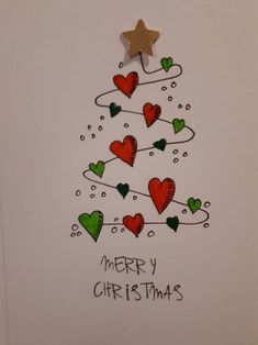 a christmas tree with hearts and a star on top is shown in this handmade card