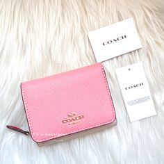 Color: Candy Pink Multi Material: Crossgrain Leather Condition: Brand New With Tag Style Number: 2923 Dimensions: 4" (L) X 3 1/4" (H) X 1 1/2" (W) Two Credit Card Slots Full-Length Bill Compartment Id Window Snap Closure Outside Zip Coin Pocket Our Crossgrain Leather Small Trifold Wallet Is Secured By A Snap Closure And Perfectly Organized To Hold Cards And Cash. 100% Authentic Price Is Firm Comes From Clean & Pet Free Environment Rare Find Sold Out Everywhere Pink Wallet Coach, Pink Trifold Wallet For Everyday Use, Coach Trifold Wallet For Daily Use, Saving List, Window Snap, Clear Backpacks, Color Candy, Perfectly Organized, List Ideas