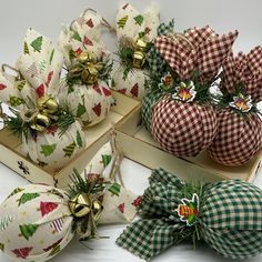 christmas ornaments in boxes with bows and bells