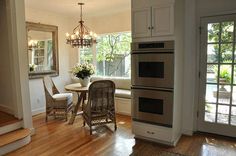 the kitchen is clean and ready to be used as a dining room or living room