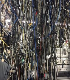 many wires are tangled together in a room