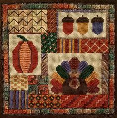 a quilted wall hanging with thanksgiving decorations and turkeys on it's side