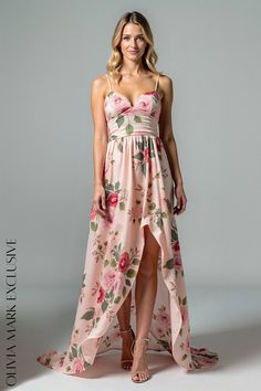 Olivia Mark - Elegant Blush Floral Wrap Maxi Dress with Asymmetrical Hemline and Strappy Bodice Flowy Pink Dress With Asymmetrical Hem, Feminine Fitted Maxi Dress With Asymmetrical Hem, Fitted Asymmetrical Maxi Dress With Floral Print, Fitted Asymmetrical Floral Print Maxi Dress, Fitted Floral Print Dress With High-low Hem, Pink Asymmetrical Hem Dress For Brunch, Party Dress With Floral Print And High-low Hem, Pink Chiffon Dress With Asymmetrical Hem, Fitted Maxi Dress With Asymmetrical Hem For Garden Party