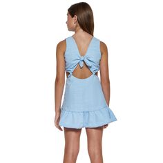 Little Peixoto Blair cut-out dress in blue cotton skies. Dress features cut-out accents, knotted details, and a ruffle hem. Pullover style. Imported. Size Conversion: (XS = 2/4), (S = 6/8), (M = 10/12), (L = 14). Beach Cotton Dress With Bow Tie Back, Light Blue Tie Back Dress For Vacation, Light Blue Vacation Dress With Tie Back, Light Blue Summer Mini Dress With Tie Back, Casual Beach Dress With Bow Tie Back, Light Blue Casual Dress With Tie Back, Blue Cutout Mini Dress For Summer, Light Blue Casual Mini Dress With Tie Back, Casual Light Blue Mini Dress With Tie Back