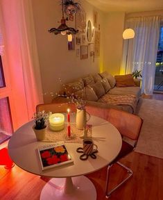 a living room filled with furniture next to a window