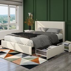 a large bed sitting on top of a hard wood floor next to a green wall