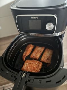 some food is being cooked in an air fryer