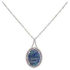 Black Australian Opal is rare and it is even rarer in this size-9 carats! It is surrounded by 84 gorgeous diamonds. When you look in this opal you will see an overall blue color with a flash of green, pink and purple. The necklace comes with the 14 karat white gold chain. Amaze your friends with this stunning opal. The details for this beautiful necklace are listed below: Metal Quality: 14K White Gold Pendant Style: Opal Halo Diamond Number: 84 Diamond Shape: Round Brilliant Diamond Total Weight Opal Diamond Halo Pendant, Multi-stone Diamond Necklace In Fine Jewelry Style, Black Opal Necklace, Black Opal Pendant, Australian Opal Pendant, Black Diamond Solitaire, Black Diamond Necklace, Opal Pendant Necklace, Double Diamond