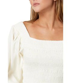 Amp up your everyday look by wearing the Rip Curl™ Talia Long Sleeve Top. The pull-on style top has a wide square neckline, full puffed sleeves, a smocked body, and a straight ruffled hemline. The elegant top blends well with the shorts or denims for an effortless everyday look..67% cotton, 31% viscose, 2% modal..Machine wash, line dry..Imported..Product measurements were taken using size SM. Please note that measurements may vary by size..Measurements: Length: 18 in White Top With Straight Neckline For Spring, Spring Smocked Top With Square Neck, Summer Smocked Top With Elastic Sleeves And Square Neck, Fitted Smocked Top With Ruched Square Neck, Feminine Tops With Gathered Sleeves And Square Neck, Feminine Tops With Square Neck And Gathered Sleeves, Summer Ruched Puff Sleeve Top With Square Neck, Summer Tops With Gathered Sleeves And Square Neck, Casual Puff Sleeve Top With Square Neck