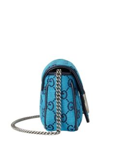 This GG Marmont super mini bag is part of the GG Multicolour collection Light blue and blue diagonal matelassé GG canvas Blue leather trim Silver-toned hardwareAttached key ring that can attach to a separate bagDouble GChain shoulder strap with 60cm dropSuper mini size: W 6.5"/16.5cm x H 3.8"/9.5cm x D 2"/4.5cmMicrofibre lining with a suede-like finishMade in Italy Gucci Blue Shoulder Bag With Removable Pouch, Blue Rectangular Gucci Bag, Blue Gucci Shoulder Bag For Everyday Use, Blue Gucci Shoulder Bag With Dust Bag, Blue Gucci Crossbody Shoulder Bag, Blue Gucci Shoulder Bag With Detachable Strap, Blue Gucci Shoulder Bag With Branded Hardware, Gucci Blue Shoulder Bag With Detachable Strap, Luxury Blue Gucci Bags