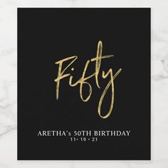 a black and gold 50th birthday card with the word fifty on it