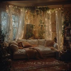 a living room filled with furniture covered in lights