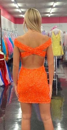 Ashley Lauren 4499 Size 4 Orchid Short Fitted Sequin Homecoming Dress off the shoulder   This fitted off the shoulder cocktail dress is accented by a crisscrossed back and covered in the most beautiful sequins!  Off the shoulder Open back Fully sequined Size: 6 Color: Neon Orange Off The Shoulder Cocktail Dress, Ashley Lauren, Sequin Homecoming Dress, Orange Fits, Orange Shorts, Homecoming Dress, Neon Orange, Homecoming Dresses, Homecoming