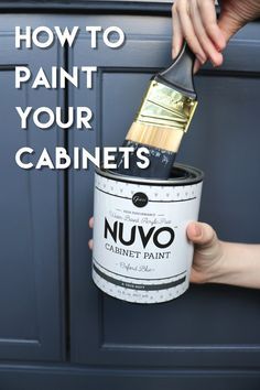 a person holding a paint can with the words how to paint your cabinet's