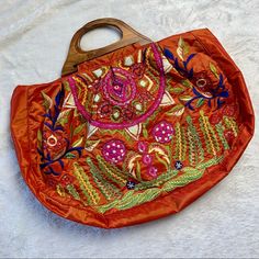 Reposhing This Item I Purchased From @Poshgoet. Loved It, Never Used. Questions? Leave A Comment Below! Spring Festival Embroidered Bags, Orange Bohemian Bags For Spring, Bohemian Orange Bags For Spring, Spring Bohemian Orange Bag, Bohemian Orange Embroidered Bag, Anthropologie Bags, Wood Handles, Boho Bag, Wood Handle