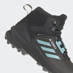 a pair of black and blue hiking boots