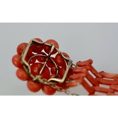 This is part of Chairish’s Costume Jewelry assortment.  Vintage circa 1950 Coral Flower Bracelet  This vintage Coral Flower Bracelet comes out of Italy and is in gorgeous condition. The bracelet is 6 1/2" long the flower Head is 2 1/4" round with ten (10) round beads circling around the Flower head and nine (9) beads centering the large Coral Stone. The bracelet is made out of Coral bars, 4 then 3 then 4 alternating. 15 cm in length 4 cm in width. 37.6 grams. Most people do not know Coral especi Mid-century Bracelet Jewelry Gift, Formal Vintage Beaded Bracelets With Round Beads, Vintage Beaded Bracelets For Formal Occasions, Vintage Polished Bead Bracelet, Vintage Polished Beads Bracelet, Vintage Round Polished Beads Jewelry, Vintage Polished Beads Bracelet Jewelry, Vintage Beaded Bracelet With Polished Beads, Coral Flower