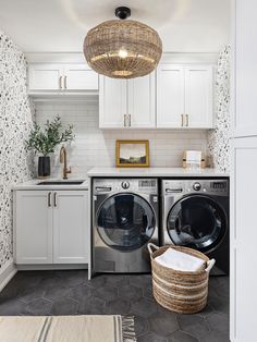 a washer and dryer in a white laundry room