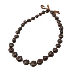 PRICES MAY VARY. Beautiful shiny solid dark brown real kukui nuts with ribbon tie. Wear as a lei or as a fashionable necklace. You can also double it around for a chunky beaded necklace look. More of a traditional type kukui nut lei, worn at weddings and during dance performances by men & women. 32" total length of nuts (does not include the ribbons you tie) Present this magnificent lei to a friend or loved one in the spirit of Aloha! The Kukui Nut with its unique shape, size and colors are hand-picked, hand -polished, and strung into a beautiful lei worn by Hawaiian Royalty, which symbolizes high honor and nobility. Present this magnificent lei to a friend or loved one in the spirit of Aloha! Hawaiian Royalty, Kukui Nut Lei, High Honor, Pineapple Christmas, Abalone Ring, Ukulele Accessories, Music Ornaments, Kukui Nut, Abalone Earrings