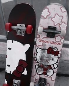 two skateboards with hello kitty designs on them